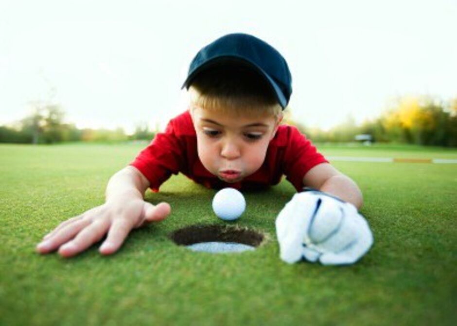 kid playing golf